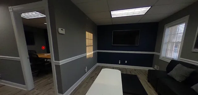 A studio office interior with a seating area