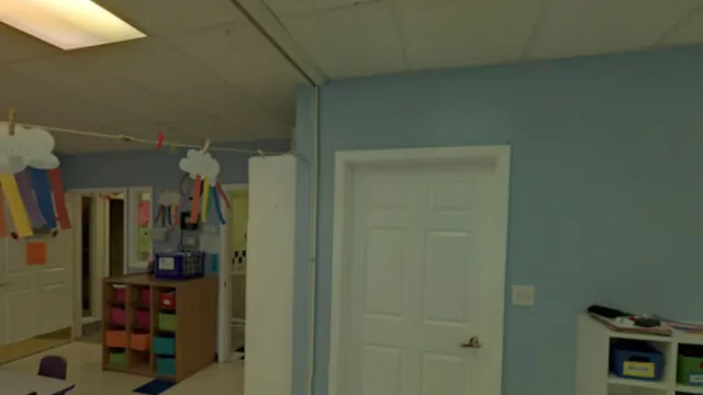 A daycare classroom with cubbies, a play area and craft displays