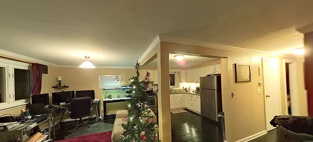 A condominium living room decorated for the holidays